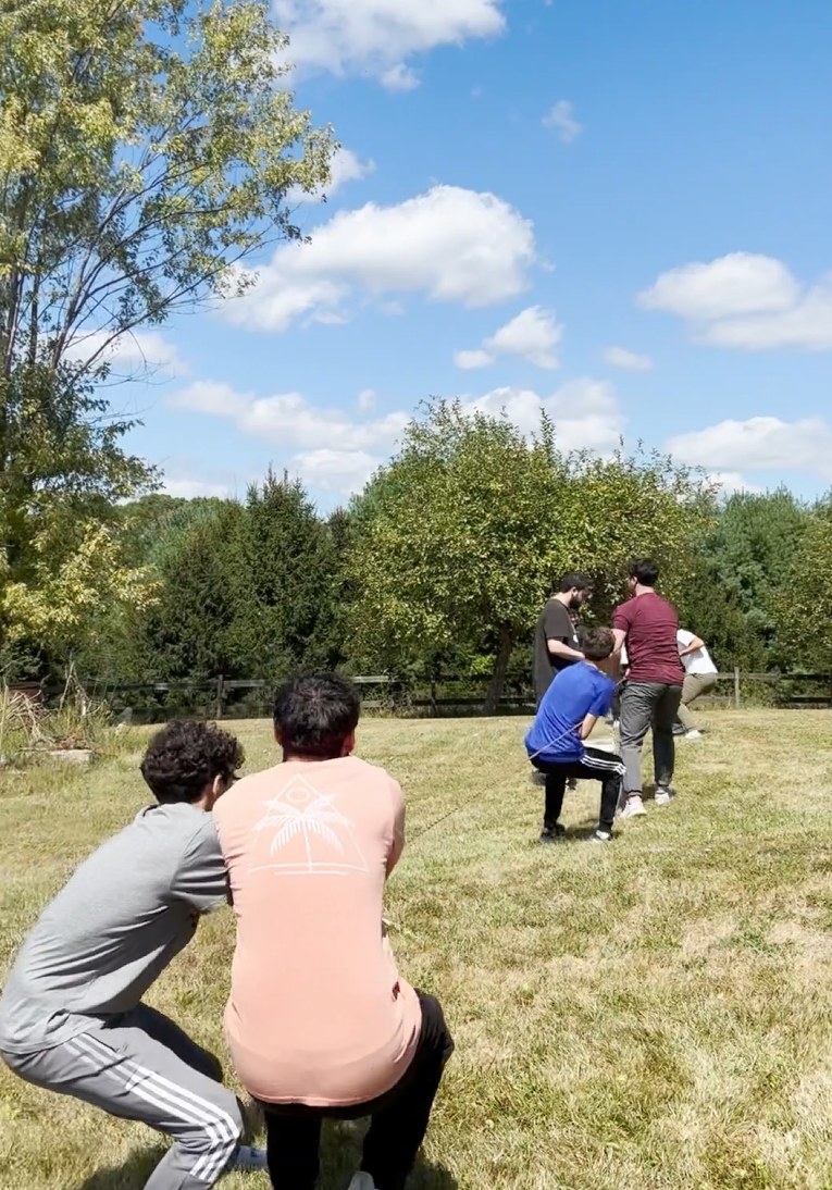 Shared effort outdoors — character forged in struggle